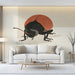 A contemporary living room wall decorated with a bold insect-themed wallpaper illustration and minimalist lighting.