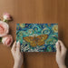 A sophisticated living room with the painterly blue and gold butterfly wall mural