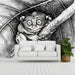 A sophisticated study room featuring a detailed primate illustration on the wall behind a wooden desk.