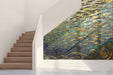 Living room featuring a deep blue and gold fish mosaic mural behind a sleek velvet sofa
