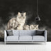 A moody entryway design with a feline-themed wall mural and dark wood furniture for an academic feel.