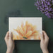 Close-up of golden petal wallpaper in a modern dining room setting