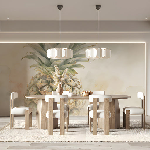 A bright, airy kitchen dining area featuring a large-scale watercolor pineapple mural on the accent wall.
