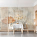 A bright dining room interior with a soft autumn oak leaf mural providing a minimalist nature-inspired backdrop.