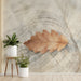 A serene entryway feature wall with a light oak leaf watercolor mural behind a neutral linen headboard.