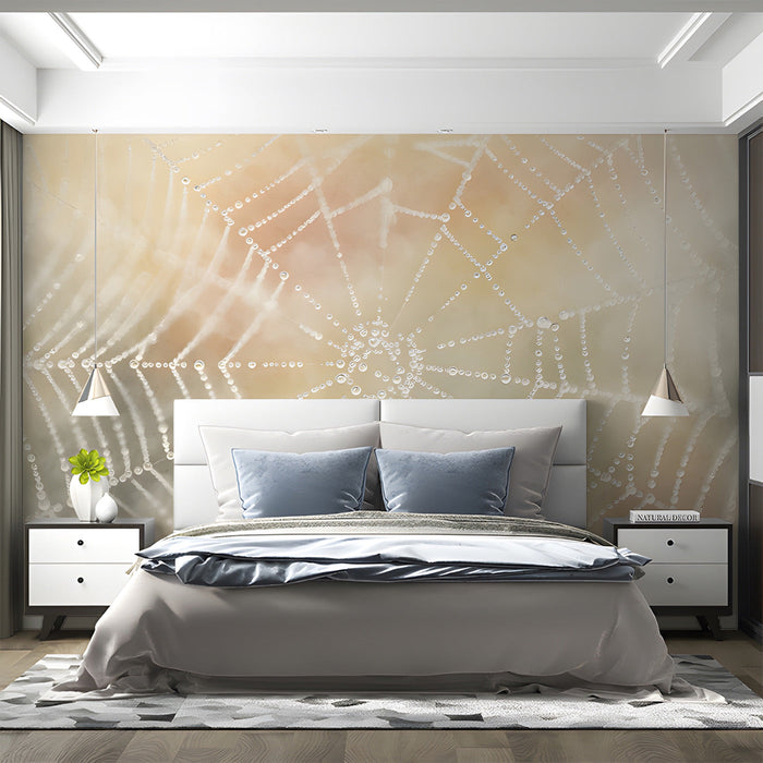 A cozy bedroom featuring the dewy spiderweb mural as a feature wall behind a beige linen headboard.