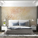 A cozy bedroom featuring the dewy spiderweb mural as a feature wall behind a beige linen headboard.