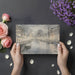 Cityscape mural wallpaper featured in a cozy reading nook with warm ambient lighting.