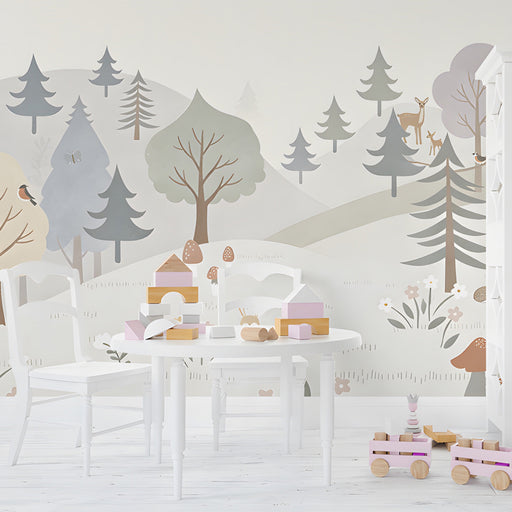 Charming nature wall mural in a bright playroom filled with soft textures and pillows.