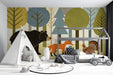 Children's bedroom featuring a playful forest animal mural with a bear and fox above a wooden crib.