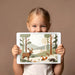 Modern bedroom wall decor showing a paper-cut style forest scene with a stag and fox motif.
