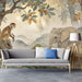 Safari animal scene wallpaper in an entryway with natural wood accents