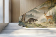 A calming entryway interior with a bamboo forest animal mural on the main wall behind a wooden bed frame.