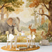 Whimsical forest animal mural installed as a playful focal point in a bright children's nursery