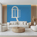 A bright, airy living room featuring the floating window mural as a focal point above a minimalist beige sofa.