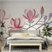 Modern bedroom featuring magnolia flower mural wallpaper above a minimalist white wooden bed frame