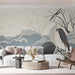 A minimalist home office space with the heron and wave mural creating a quiet, focused backdrop behind a desk.