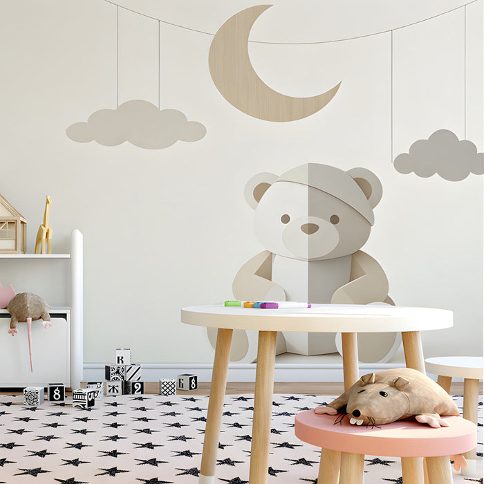 A serene playroom corner with the bear and moon wall mural, paired with a comfortable armchair and warm lighting.