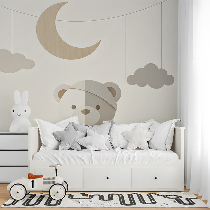 A cozy bedroom featuring a neutral bear mural behind a white wooden crib and soft linen bedding.