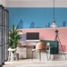 A modern study room featuring the city terrace wallpaper as a sleek backdrop behind a minimalist sofa.