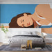 Modern bedroom featuring a minimalist figure mural wallpaper behind a sleek wooden desk