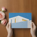 Bright living room featuring a geometric sky blue and white architectural mural