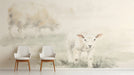 A serene entryway featuring a watercolor sheep mural on the main wall with light wood crib furniture.