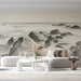 Home office featuring a moody ink wash landscape mural behind a wooden desk