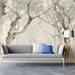 Atmospheric tree-lined path mural in a bright, airy study with linen sofa.