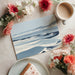 Coastal dune wallpaper applied in a modern home office space with a clean minimalist desk.