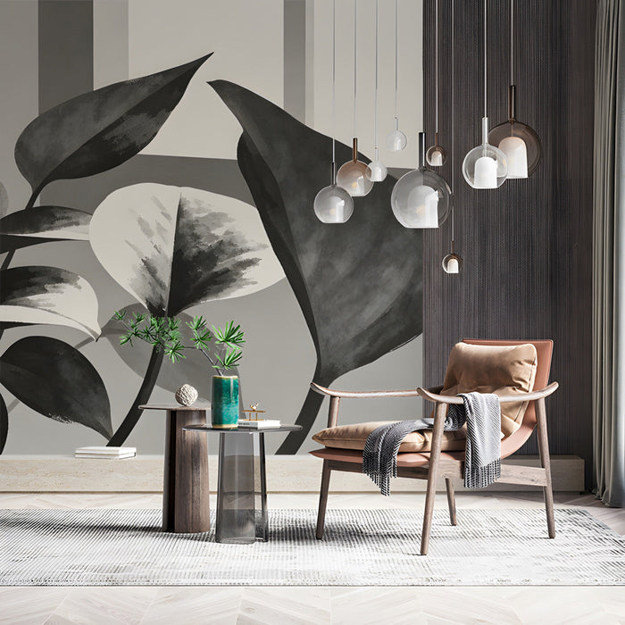 Study featuring monochrome leaf mural wallpaper behind a mid-century modern sofa.