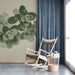 Minimalist botanical wall mural installed in a serene study with natural wood furniture