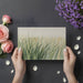 Nature-inspired wall art in a modern sunroom with indoor plants and light decor.