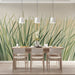 Watercolor grass mural installed in a bright, airy dining room with oak furniture.