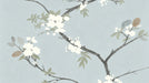 Watercolor style cherry blossom branches in charcoal and white on a soft sky blue background.