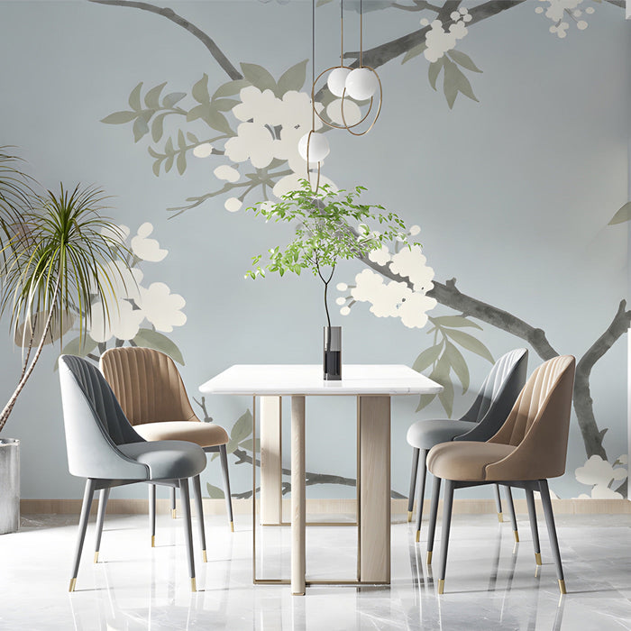 A quiet dining room featuring subtle floral wall mural with white blossoms.
