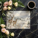 Snowy deer landscape mural as a focal point in a dining room with a farmhouse table