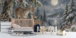 A cozy bedroom with a winter deer forest mural behind the headboard and soft neutral bedding.