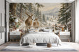 A cozy bedroom wall featuring a snowy winter forest mural with deer and mountains.