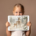 Wildlife wall mural featured in a modern bedroom with neutral linen bedding