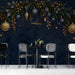 Festive bar wall featuring a navy-blue garland mural backdrop behind a long wooden table.