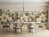 A cozy dining room featuring the floral garland mural above a dark wood sideboard and white dinnerware.
