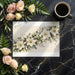 Botanical wall art featuring white flowers installed as an accent in a master bedroom