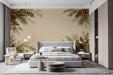 A cozy bedroom featuring the festive foliage mural as a feature wall behind a beige linen sofa.