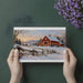 Festive dining room decorated with a snowy country barn landscape wall mural