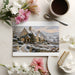 Snowy landscape wallpaper featured in a cozy dining area with wooden furniture