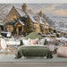 Cottage scene mural in a quiet bedroom with a plush armchair