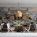 A peaceful cottage scene wallpaper covering the wall of a restaurant.