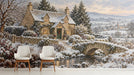 Snowy cottage mural installed on a large entryway feature wall behind a cozy grey sofa.