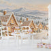 A kid's room wall featuring a gingerbread village mural, creating a festive holiday backdrop for family gatherings.
